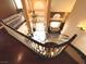 Open floor plan with large entry way, chandelier, and winding staircase at 8690 W Ford Ave, Las Vegas, NV 89148