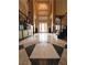 Grand foyer featuring soaring ceilings, decorative tile flooring, and a view of the front entrance at 8690 W Ford Ave, Las Vegas, NV 89148