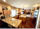 Spacious kitchen featuring wooden cabinets, granite countertops, double islands, and modern stainless steel appliances at 8690 W Ford Ave, Las Vegas, NV 89148