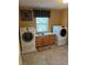 Laundry room with washer, dryer, sink, and cabinet at 8690 W Ford Ave, Las Vegas, NV 89148