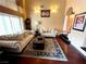 Bright living room featuring hardwood floors, comfortable seating, and stylish decor with ample natural light at 8690 W Ford Ave, Las Vegas, NV 89148
