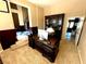 An office features a desk, large shelving unit and is adjacent to the stairs at 8690 W Ford Ave, Las Vegas, NV 89148