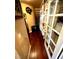Walk-in pantry with custom shelving and a frosted glass door for organized storage at 8690 W Ford Ave, Las Vegas, NV 89148