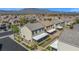 Aerial view of the home featuring a covered patio, and well manicured landscaping at 9113 Sea Mink Ave, Las Vegas, NV 89149
