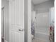 Clean bathroom with a shower-tub combination and white tile, ideal for easy maintenance at 9113 Sea Mink Ave, Las Vegas, NV 89149