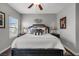 Comfortable bedroom with king size bed, ceiling fan, and modern decor at 9113 Sea Mink Ave, Las Vegas, NV 89149