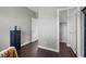 Neutral-toned bedroom with a closet and dark wood floors, ready for comfortable living at 9113 Sea Mink Ave, Las Vegas, NV 89149