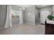 Bright dining area with tiled floors, chandelier, and large window at 9113 Sea Mink Ave, Las Vegas, NV 89149