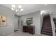 Inviting entryway with tiled floor, chandelier, and staircase at 9113 Sea Mink Ave, Las Vegas, NV 89149