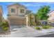 Two-story home with manicured front yard, desert landscaping, and a welcoming entrance at 9113 Sea Mink Ave, Las Vegas, NV 89149