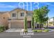 Charming two-story home featuring a well-manicured lawn and desert-friendly landscaping at 9113 Sea Mink Ave, Las Vegas, NV 89149