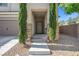A covered front entrance with stone accents and desert landscaping at 9113 Sea Mink Ave, Las Vegas, NV 89149