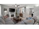 Cozy living room with a fireplace, neutral color palette, and comfortable seating arrangement at 9113 Sea Mink Ave, Las Vegas, NV 89149