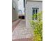 Long driveway on side of house with pavers leading to backyard gate at 10077 Cooper Mountain St, Las Vegas, NV 89141