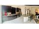 Well-appointed kitchen with stainless steel appliances, granite countertops, and a breakfast bar at 10077 Cooper Mountain St, Las Vegas, NV 89141