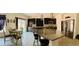 Modern kitchen with dark cabinets, granite countertops, large island, and stainless steel appliances at 10077 Cooper Mountain St, Las Vegas, NV 89141