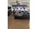 Cozy living room featuring a large sectional sofa and a flat-screen TV at 10077 Cooper Mountain St, Las Vegas, NV 89141