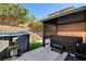 Outdoor area with a pool, hot tub, and shaded patio, perfect for relaxing and entertaining at 10666 Cherry Ridge Ct, Las Vegas, NV 89129