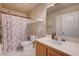 Cozy bathroom featuring a shower with tub, toilet, and a vanity with sink at 10666 Cherry Ridge Ct, Las Vegas, NV 89129