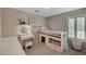 Charming bedroom with built-in storage, vanity, and a bright window with plantation shutters at 10666 Cherry Ridge Ct, Las Vegas, NV 89129