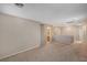 Open loft area featuring neutral carpeting, paint, and access to an adjacent bathroom at 10666 Cherry Ridge Ct, Las Vegas, NV 89129