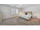 Spacious main bedroom with neutral walls and carpeting, and a bright window with plantation shutters at 10666 Cherry Ridge Ct, Las Vegas, NV 89129