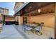 Relaxing patio with string lights, dining set, and hot tub for outdoor living at 10666 Cherry Ridge Ct, Las Vegas, NV 89129
