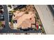 An aerial view of a condo complex showing roof lines, parking areas, and nearby highway at 10809 Garden Mist Dr # 2050, Las Vegas, NV 89135