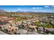 Beautiful aerial view of a residential neighborhood with lush greenery and mountain backdrop at 10809 Garden Mist Dr # 2050, Las Vegas, NV 89135