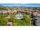 Overhead view of community pool area and well-manicured landscaping in a residential area at 10809 Garden Mist Dr # 2050, Las Vegas, NV 89135