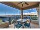 Relaxing covered balcony with seating area, perfect for enjoying views of the surrounding landscape at 10809 Garden Mist Dr # 2050, Las Vegas, NV 89135