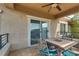 Outdoor balcony area with table and chairs, ideal for al fresco dining and entertaining at 10809 Garden Mist Dr # 2050, Las Vegas, NV 89135