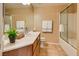Bright bathroom featuring a vanity with a countertop, sink and shower with glass door at 10809 Garden Mist Dr # 2050, Las Vegas, NV 89135