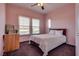 Bright bedroom with white bedding, neutral paint, and nice windows at 10809 Garden Mist Dr # 2050, Las Vegas, NV 89135