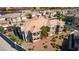 Exterior view of a brown and beige multi-unit condo building with balconies and a view of the highway at 10809 Garden Mist Dr # 2050, Las Vegas, NV 89135