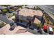 Exterior view of a brown and beige multi-unit condo building with 2-car garages in a residential neighborhood at 10809 Garden Mist Dr # 2050, Las Vegas, NV 89135