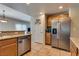 Kitchen area with stainless appliances, granite countertops, and bright light at 10809 Garden Mist Dr # 2050, Las Vegas, NV 89135