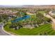 Aerial view of Rhodes Ranch, showcasing the golf course, lush landscaping and tranquil pond at 115 Cora Hills Ct, Las Vegas, NV 89148