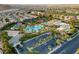 An aerial shot of a recreation center and community featuring multiple pools, courts, and parking at 115 Cora Hills Ct, Las Vegas, NV 89148