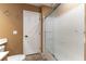 A bathroom showing the commode, door and walk-in shower with glass doors at 115 Cora Hills Ct, Las Vegas, NV 89148