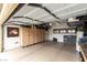 This garage has beige cabinets, three mirrored windows, and an epoxy floor at 115 Cora Hills Ct, Las Vegas, NV 89148