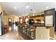 Spacious kitchen features a breakfast bar with seating and access to the living area at 115 Cora Hills Ct, Las Vegas, NV 89148