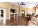 Comfortable living room with fireplace, hardwood floors, and stylish decor, great for relaxation at 115 Cora Hills Ct, Las Vegas, NV 89148