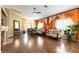 Bright living room features hardwood floors, fireplace, and elegant furnishings, a perfect gathering space at 115 Cora Hills Ct, Las Vegas, NV 89148