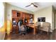 This office features a desk, hutch, hardwood floors, and relaxing seating at 115 Cora Hills Ct, Las Vegas, NV 89148