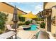 A backyard pool, spa, covered patio, and grill making it perfect for outdoor entertaining at 115 Cora Hills Ct, Las Vegas, NV 89148