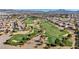 Aerial view of a golf course and the surrounding neighborhood at 1152 Pine Cove Ct, Henderson, NV 89011