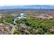 A scenic aerial shot captures a waterway winding through a lush green landscape at 1152 Pine Cove Ct, Henderson, NV 89011