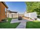 This well-manicured backyard boasts an artificial turf lawn and custom hardscape patio at 1152 Pine Cove Ct, Henderson, NV 89011