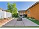 Backyard featuring a covered patio area, artificial turf, and privacy walls at 1152 Pine Cove Ct, Henderson, NV 89011
